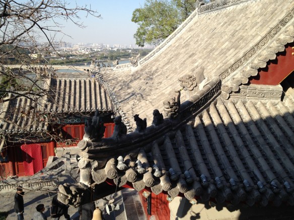 modern city of Luoyang in the distance