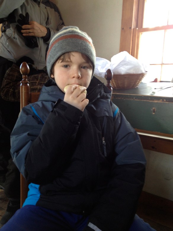 boy eating his third cake